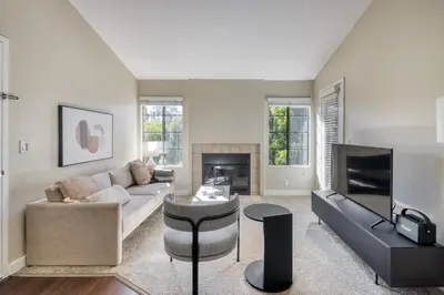 a living room with a couch and a tv at La Jolla 1br w gym wd pool nr bars shops SAN-8 in San Diego