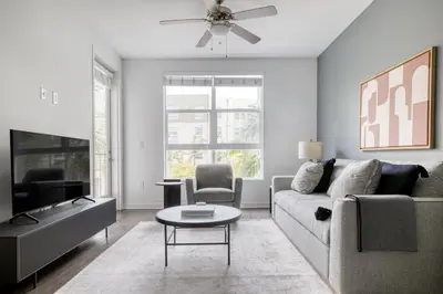 a living room with a couch and a tv at Mission Valley 1br w gym wd pool nr bars SAN-14 in San Diego