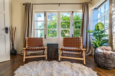 two chairs in a living room with a large window at Ocean View Spanish Beauty Half Block to Beach in San Diego