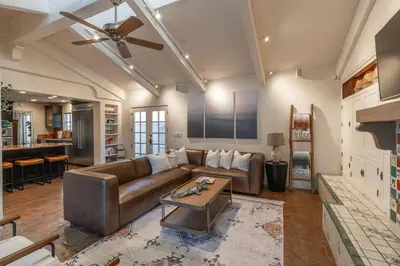 a living room with a couch and a table at Ocean View Spanish Beauty Half Block to Beach in San Diego