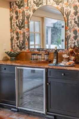 a kitchen counter with a mirror and a sink at Ocean View Spanish Beauty Half Block to Beach in San Diego