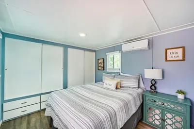 a bedroom with a bed and a blue wall at Low-Key Poway Home about 20 Mi to La Jolla and San Diego in Poway
