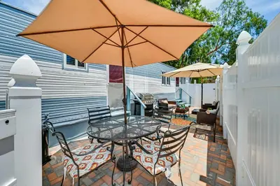 a patio with a table and an umbrella at Low-Key Poway Home about 20 Mi to La Jolla and San Diego in Poway