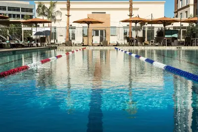 a swimming pool withkeredkered dividers in the water at Courtyard by Marriott Irvine Spectrum in Irvine