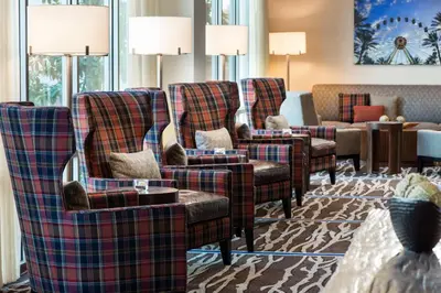 a row of plaid chairs in a waiting room at Courtyard by Marriott Irvine Spectrum in Irvine