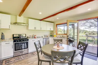 a kitchen with a table and chairs and a dining room at Julian Cottage Stay with Near Wildlife and Wineries in Julian