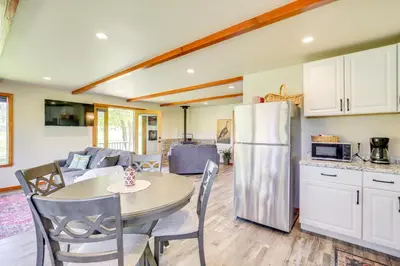 a kitchen and dining room with a table and a refrigerator at Julian Cottage Stay with Near Wildlife and Wineries in Julian