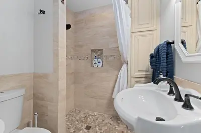 a bathroom with a white sink and a toilet at LOVELY Ocean View Beach House 3BR Sleeps 9 in San Diego