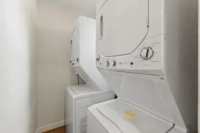 a white washing machine with a mirror in a bathroom at LOVELY Ocean View Beach House 3BR Sleeps 9 in San Diego