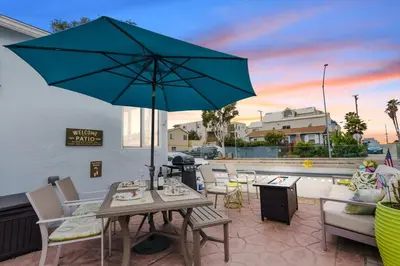 a patio with a table and an umbrella at Beach-2-Bay 2br - Beach - AC - Patio in San Diego