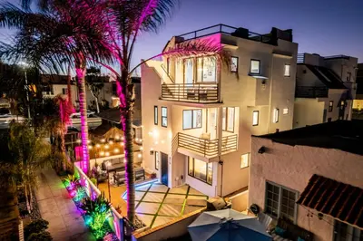 an overhead view of a building with palm trees and lights at Ocean & Bay Panorama 4 Levels Rooftop with Hot Tub in San Diego