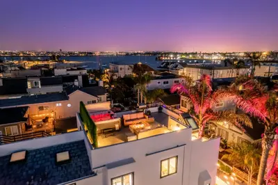 an aerial view of a city at night at Ocean & Bay Panorama 4 Levels Rooftop with Hot Tub in San Diego
