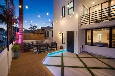 a house with a pool in the yard at Ocean & Bay Panorama 4 Levels Rooftop with Hot Tub in San Diego
