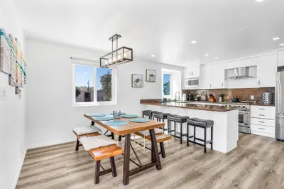 a kitchen and dining room with a table and chairs at Ocean & Bay Panorama 4 Levels Rooftop with Hot Tub in San Diego