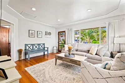 a living room with a couch and a table at South Park - Mountain Views - Central - Tranquil in San Diego
