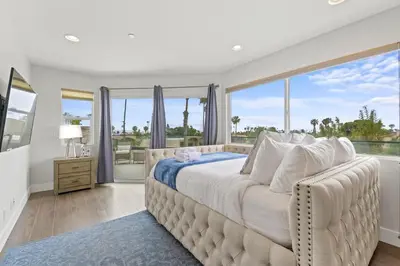 a bedroom with a large bed and a large window at Pacific Beach Paradise by Cardo -Spacious Retreat in San Diego