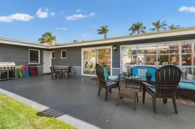 a patio with chairs and tables on a house at 3 Living Rooms - Spacious - Family-Friendly in National City