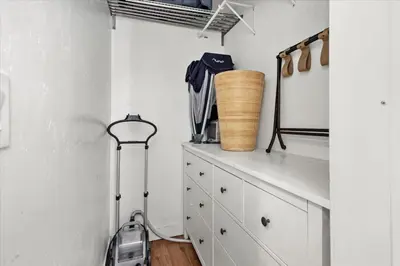 a room with a cabinet and a vacuum at NEW Beautiful BOHO Home by Beach, Downtown + Shops in San Diego