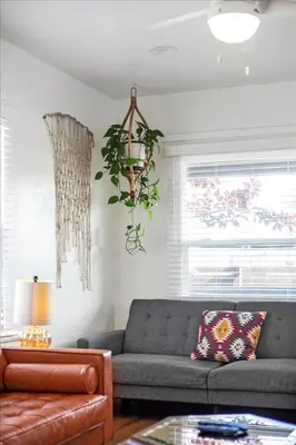 a living room with a couch and a table at NEW Beautiful BOHO Home by Beach, Downtown + Shops in San Diego