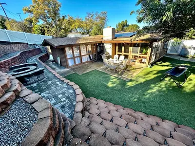 a backyard with a pool and a house at NEW Beautiful San Diego Mid-Century Treehouse in Spring Valley