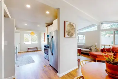 a kitchen and living room with a refrigerator at NEW Beautiful San Diego Mid-Century Treehouse in Spring Valley