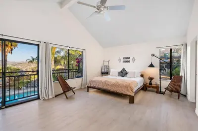 a bedroom with a bed and a large window at Sun&Star Studded Central Luxury with Hottub, Pool, Views in Escondido
