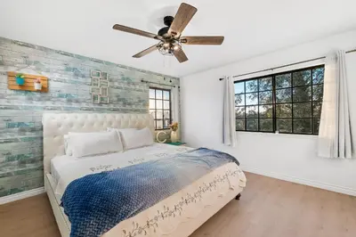 a bedroom with a bed and a ceiling fan at Sun&Star Studded Central Luxury with Hottub, Pool, Views in Escondido