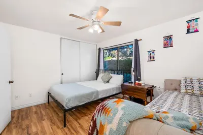 a bedroom with two beds and a ceiling fan at Sun&Star Studded Central Luxury with Hottub, Pool, Views in Escondido