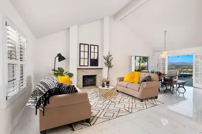 a living room with two couches and a fireplace at Sun&Star Studded Central Luxury with Hottub, Pool, Views in Escondido