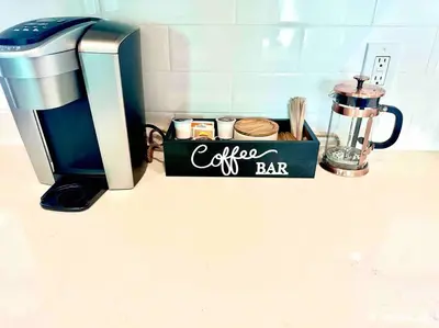 a kitchen counter with a coffee bar sign next to a blender at Modern Home with View and Large Private backyard in San Diego