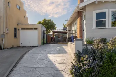 a driveway leading to a house with a garage at South Park Charmer - Close to Zoo - Backyard Oasis in San Diego