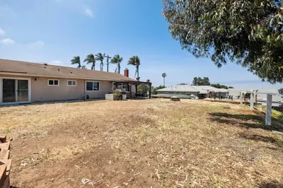 an empty yard in front of a house at Family Retreat by Cardo - Sleeps 10 in National City