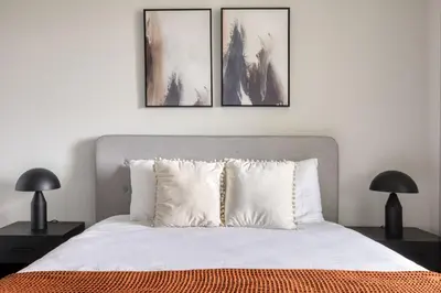 a bedroom with a bed with three pictures on the wall at Carmel Valley 2br w gym bbq wd nr dining SAN-28 in San Diego