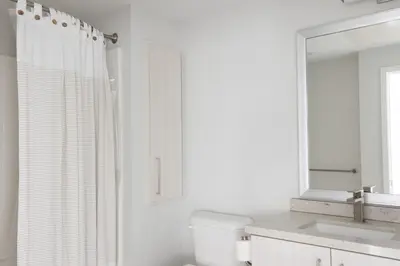 a white bathroom with a sink and a mirror at Carmel Valley 2br w gym bbq wd nr dining SAN-28 in San Diego