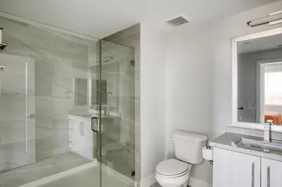 a bathroom with a shower and a toilet and a sink at Carmel Valley 2br w gym bbq wd nr dining SAN-28 in San Diego