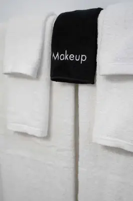 a group of white towels with the word make up on them at Pacific Beach Charm Beach and Shops Steps Away in San Diego