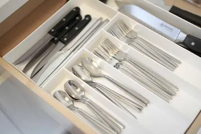 a drawer with silver utensils in a box at Pacific Beach Charm Beach and Shops Steps Away in San Diego
