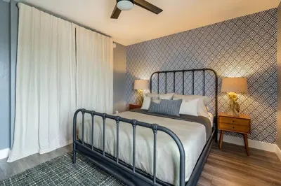 a bedroom with a bed and a large window at PORCHLIGHT HOME Central San Diego FREE parking in San Diego