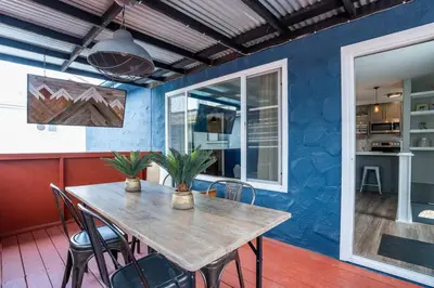 a dining room with a wooden table and chairs at PORCHLIGHT HOME Central San Diego FREE parking in San Diego
