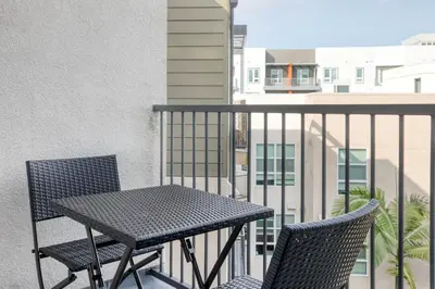 a black table and two chairs on a balcony at Mission Valley 1br w gym wd pool nr bars SAN-18 in San Diego