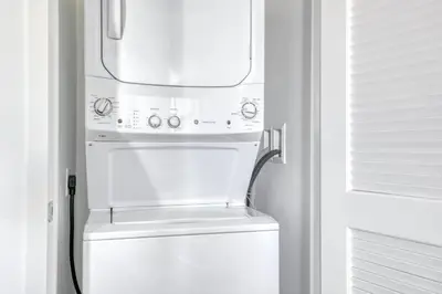 a white refrigerator freezer sitting inside of a kitchen at Mission Valley 1br w gym wd pool nr bars SAN-18 in San Diego