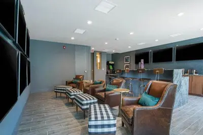 a waiting room with leather chairs and a bar at Mission Valley 1br w gym wd pool nr bars SAN-18 in San Diego