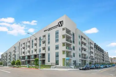 a large white apartment building with a sign on it at Mission Valley 1br w gym wd pool nr bars SAN-18 in San Diego
