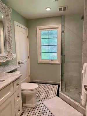 a bathroom with a toilet and a shower and a window at Ocean Breeze Haven Sunset & Pool La Jolla in San Diego