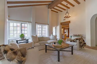 a living room with a couch and a table at Idyllic Casita on Private Fairbanks Ranch Estate in Rancho Santa Fe