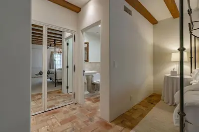 a bedroom with a bed and a room with a bathroom at Idyllic Casita on Private Fairbanks Ranch Estate in Rancho Santa Fe