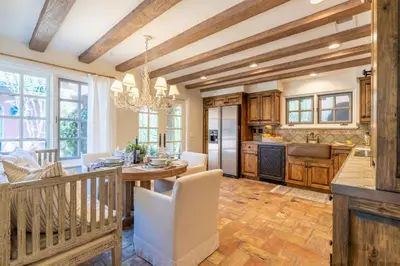a kitchen and dining room with a table and chairs at Idyllic Casita on Private Fairbanks Ranch Estate in Rancho Santa Fe