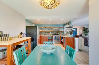 a kitchen with a table with a bowl on it at Carlsbad Rental with Private Balcony and Pool Access! in Carlsbad
