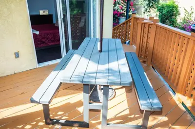 a blue picnic table sitting on a deck at Hillcrest San Diego Canyon Oasis in San Diego