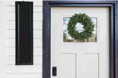 a white front door with a wreath on it at Entire 2 bedroom Pet Friendly Guest Cottage in Alpine
